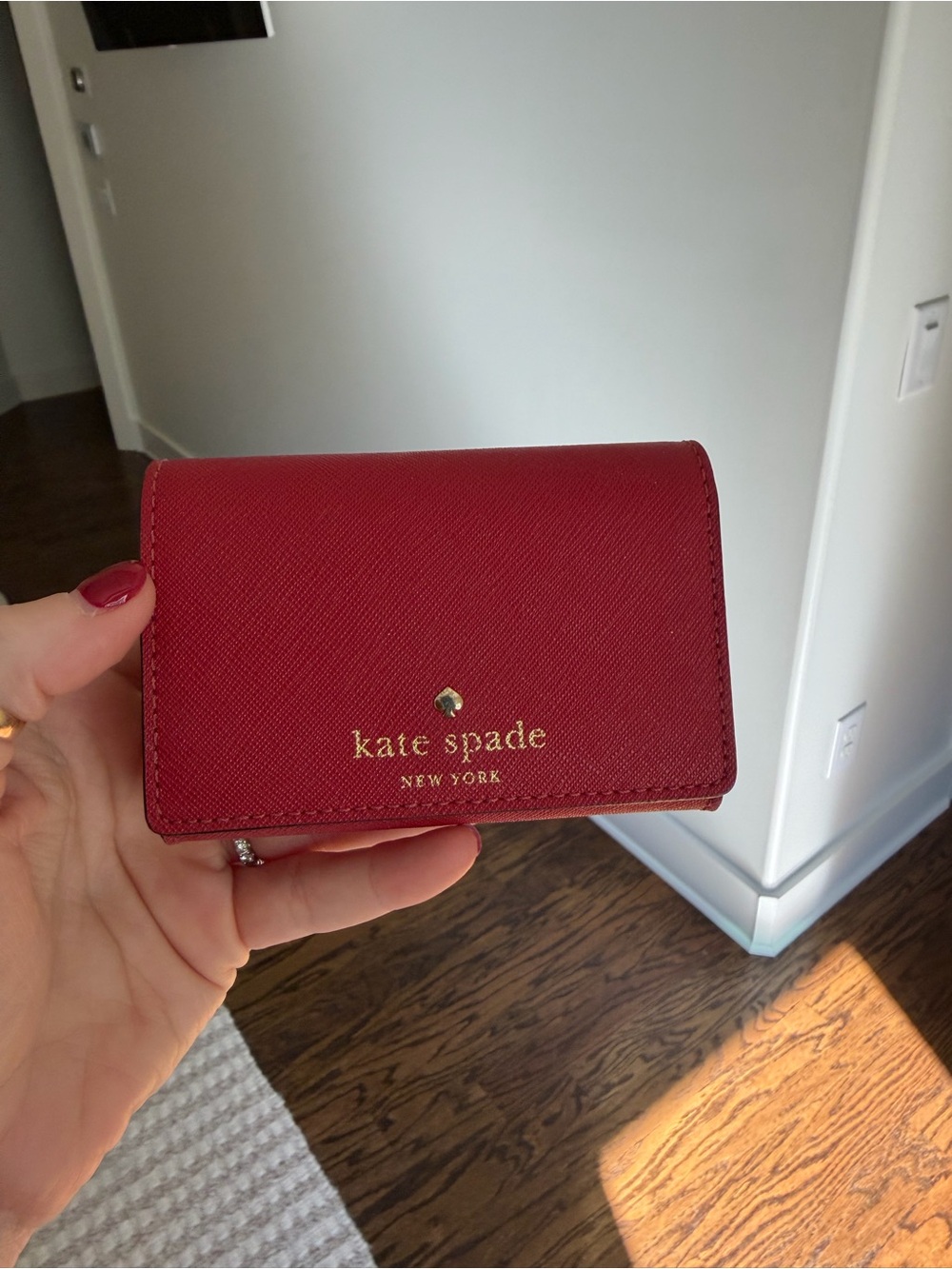 kate spade red leather card holder with gold logo